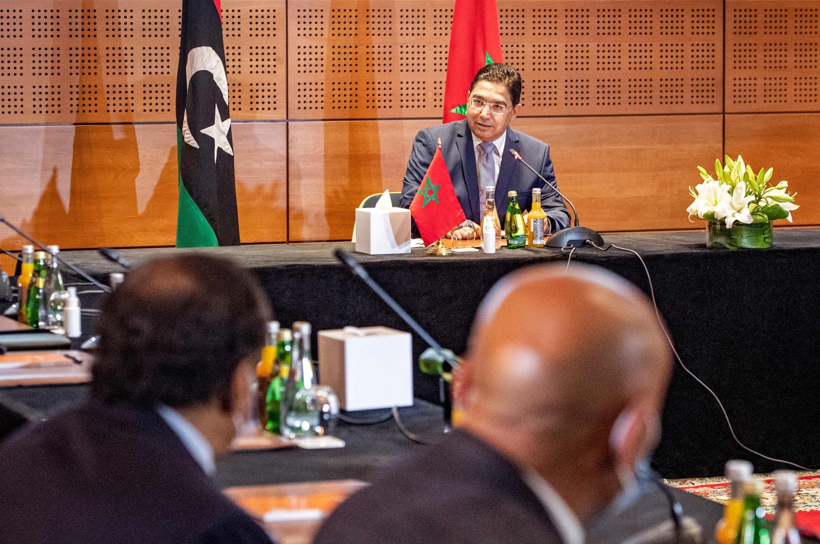 Nasser Bourita (C), Morocco's Minister of Foreign Affairs and International Cooperation, chairs a meeting of representatives of Libya's rival administrations in the coastal town of Bouznika, south of Rabat, on Sept. 6, 2020. (AFP Photo)