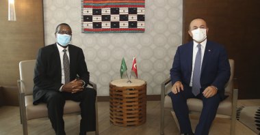Turkey's Foreign Minister Mevlüt Çavuşoğlu (R) and Pierre Buyoya, high representative of the African Union for Mali and the Sahel, pose for photos before their talks in Bamako, Mali, Sept. 9, 2020. (AP Photo)