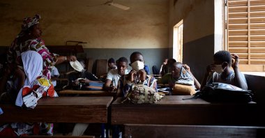 Malian students attend a lesson as the government decided to reopen the schools after two months of closure due to the spread of COVID-19 coronavirus, in Mali's capital Bamako, June 2, 2020. (AFP Photo)