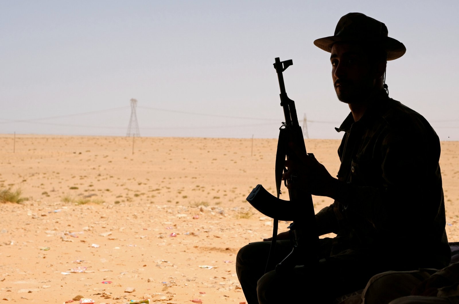 A member of putschist Gen. Khalifa Haftar's militia sits in a tent at one of their sites west of Sirte, Libya, Aug. 19, 2020. (Reuters File Photo)