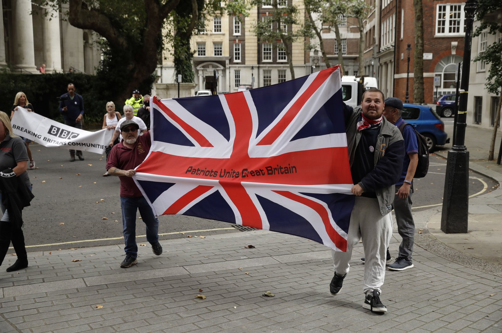Supporters of Brexit and U.S. President Donald Trump demonstrate outside the Europe House in London, Britain, Sept. 9, 2020. (AP Photo)