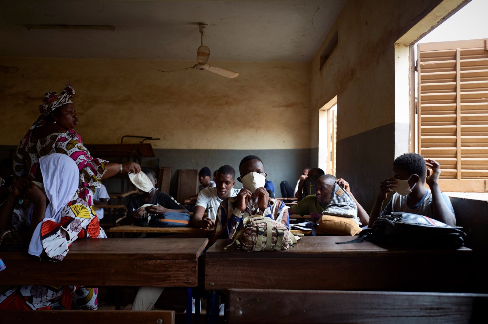 Malian students attend a lesson as the government decided to reopen the schools after two months of closure due to the spread of COVID-19 coronavirus, in Mali's capital Bamako, June 2, 2020. (AFP Photo)