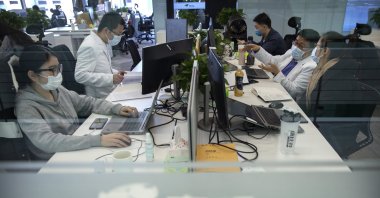 JD Health doctors use computers to chat online as they consult with patients at the JD.com headquarters in Beijing, China, March 27, 2020. (AP Photo)