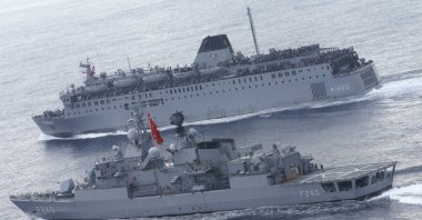 Turkish Navy personnel carrier TCG Iskenderun is escorted by the TCG Yavuz frigate as it sets sail in the Mediterranean Sea on its way to the Port of Marmaris, in Muğla province, southwestern Turkey, in this undated photo. (Reuters Photo)