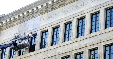 A worker paints the facade of the Swiss National Bank's (SNB) building in Zurich, Switzerland, Sept. 9, 2020. (Reuters Photo)
