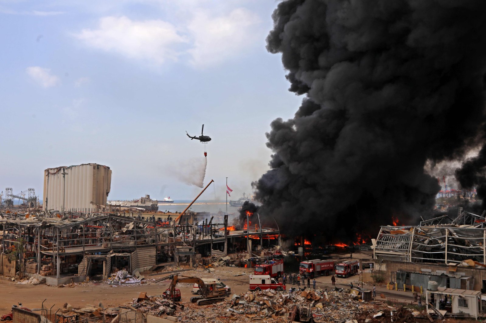 Lebanese firefighters try to put out a fire that broke out at Beirut's port area, on September 10, 2020. (AFP Photo)
