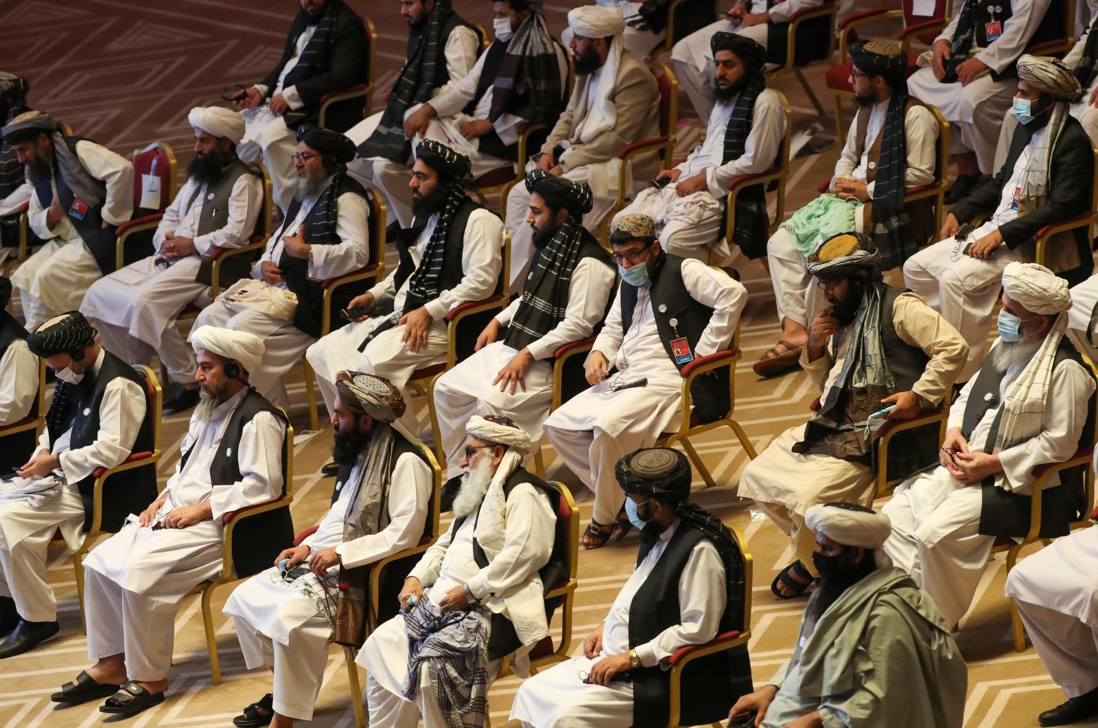 Members of the Taliban delegation attend the opening session of the peace talks between the Afghan government and the Taliban in Doha, Qatar, Sept. 12, 2020. (AFP Photo)