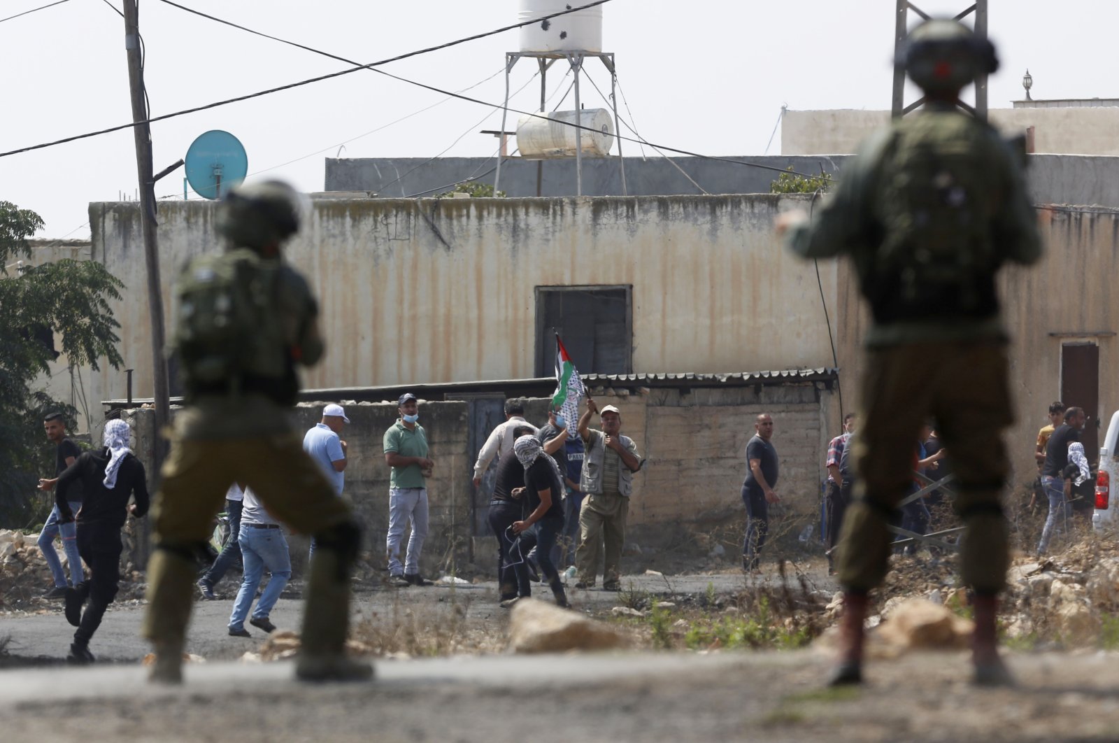 Israeli troops clash with the Palestinian demonstrators following a weekly demonstration against Israeli Jewish settlements, in the West Bank, Sept. 4, 2020. (AP Photo)