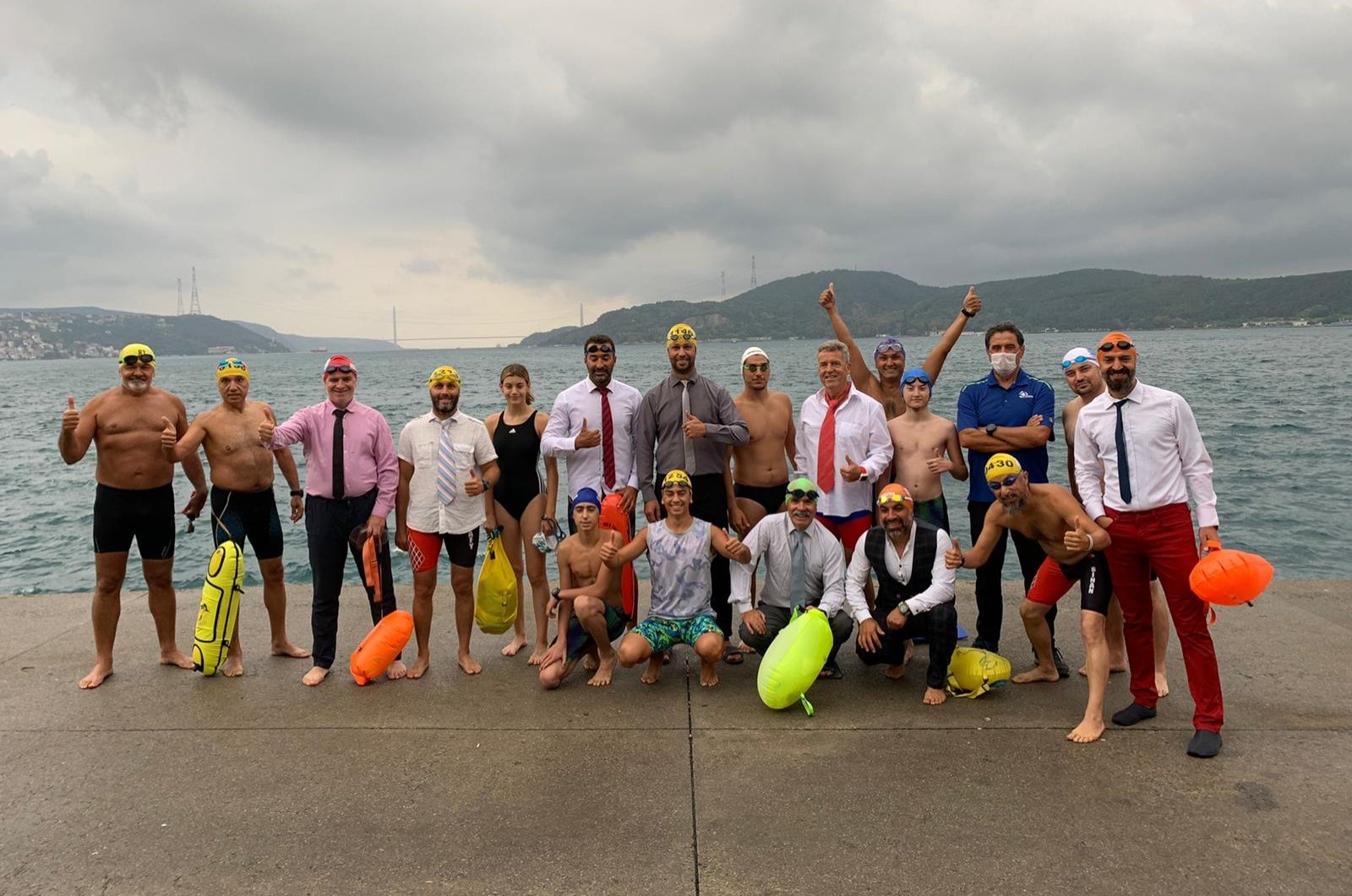 The "Masters of Bosporus" swimming group poses for a photo before their swim in the Bosporus, Istanbul, Turkey, Sept. 13, 2020. (DHA Photo)