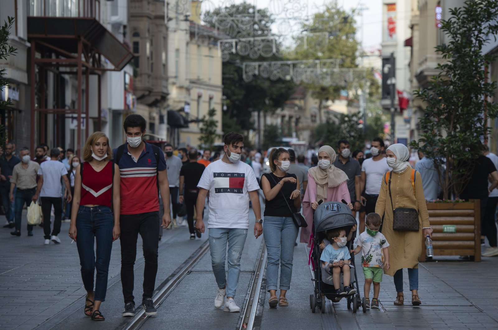 People wearing face masks walk along Istiklal Avenue in Istanbul, Turkey, Sept. 11, 2020. (AP Photo)