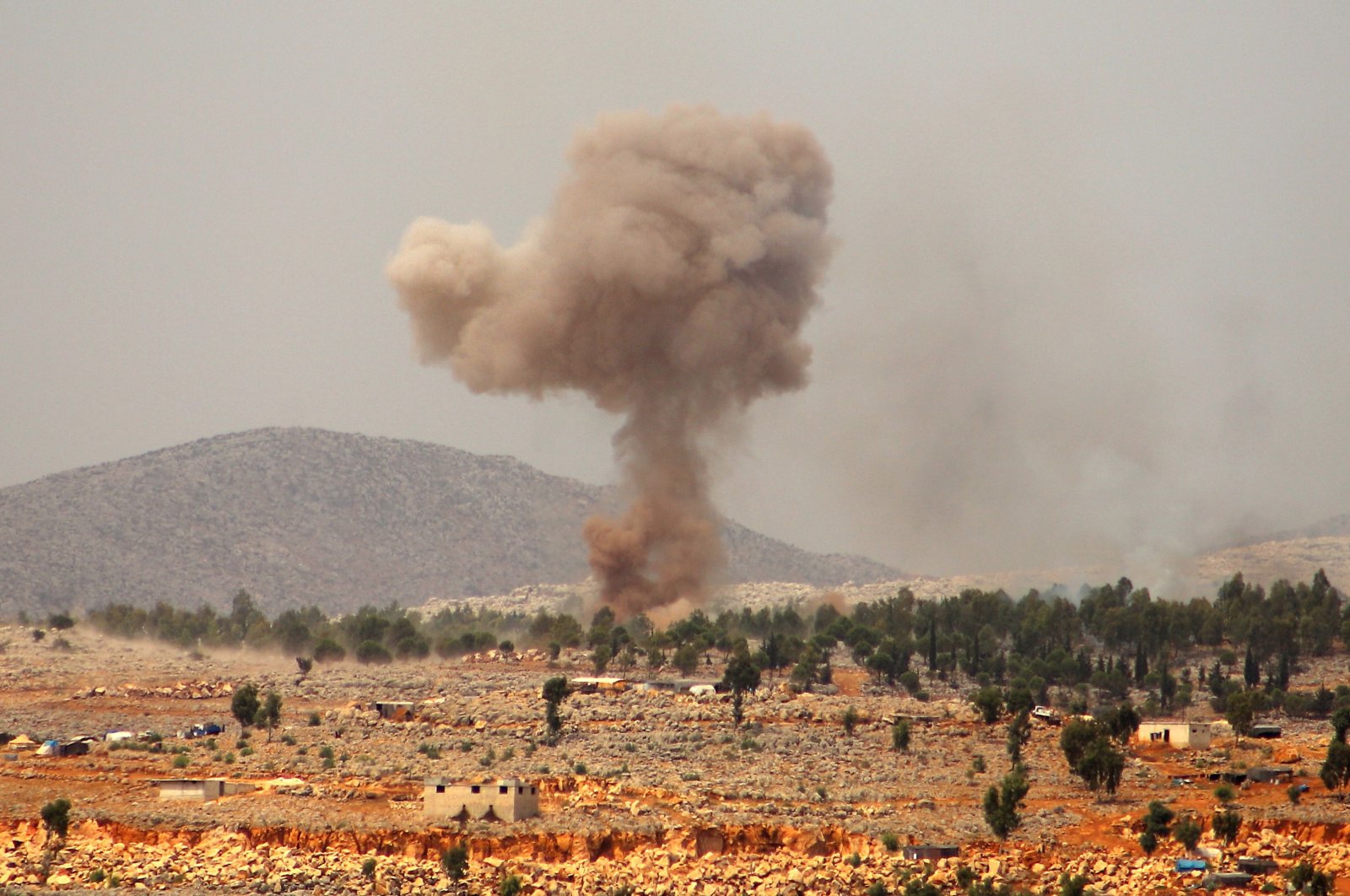 Smoke billows from a reported Russian airstrike near the village of Hafsarjah, in the western countryside of Idlib province in northwestern Syria, Sept. 11, 2020. (AFP Photo)