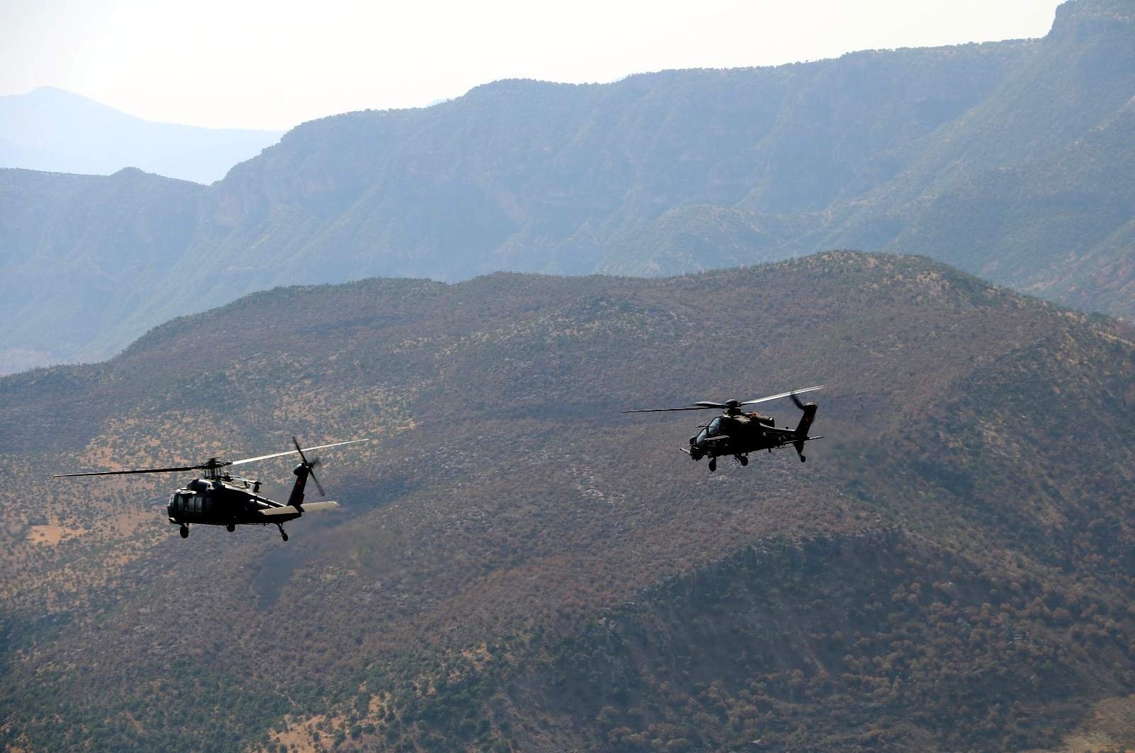 Two Turkish military helicopters take part in a counterterrorism operation against the PKK in southeastern Turkey's Siirt, Sept. 15, 2020. (DHA Photo)