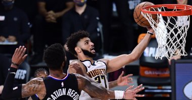 Denver Nuggets' Jamal Murray (R) drives to the basket against LA Clippers' Marcus Morris during an NBA game in Lake Buena Vista, Florida, U.S., Sept. 15, 2020. (AFP Photo)
== FOR NEWSPAPERS, INTERNET, TELCOS & TELEVISION USE ONLY ==