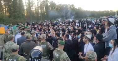 Jewish pilgrims are stuck between Ukrainian and Belarusian border crossings, Sept. 16, 2020. (Ukraine border guard service Photo via AFP)