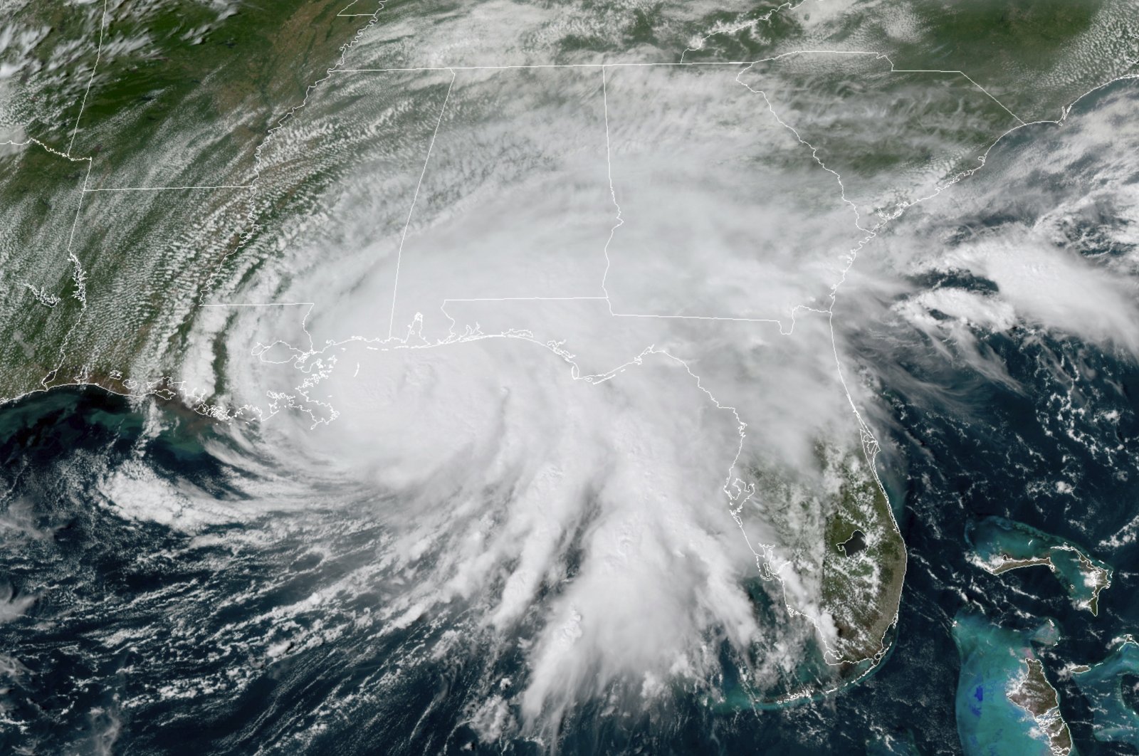 This GOES-16 GeoColor satellite image, provided by NOAA, shows Hurricane Sally moving slowly toward the coast from the Gulf of Mexico, at 3 p.m. EDT, Sept. 15, 2020. (AP Photo)