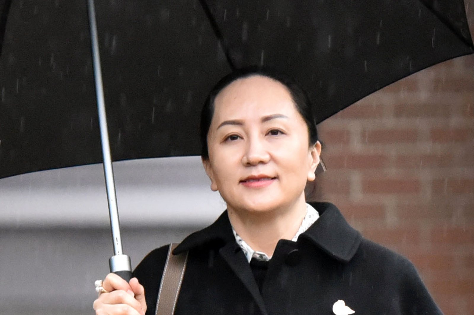 In this file photo taken on Jan. 23, 2020, Huawei chief financial officer Meng Wanzhou leaves her Vancouver home to go to her extradition hearing in British Columbia Supreme Court in Vancouver, British Columbia. (AFP Photo)