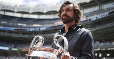 Andrea Pirlo lifts the UEFA Champions League Trophy during a special event held at Yankee Stadium in New York, U.S., Sept. 27, 2019. (AP Photo)
