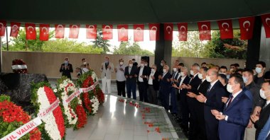 People recite prayers by the grave of Adnan Menderes, in Istanbul, Turkey, Sept. 17, 2020. (PHOTO BY MUSTAFA KAYA)