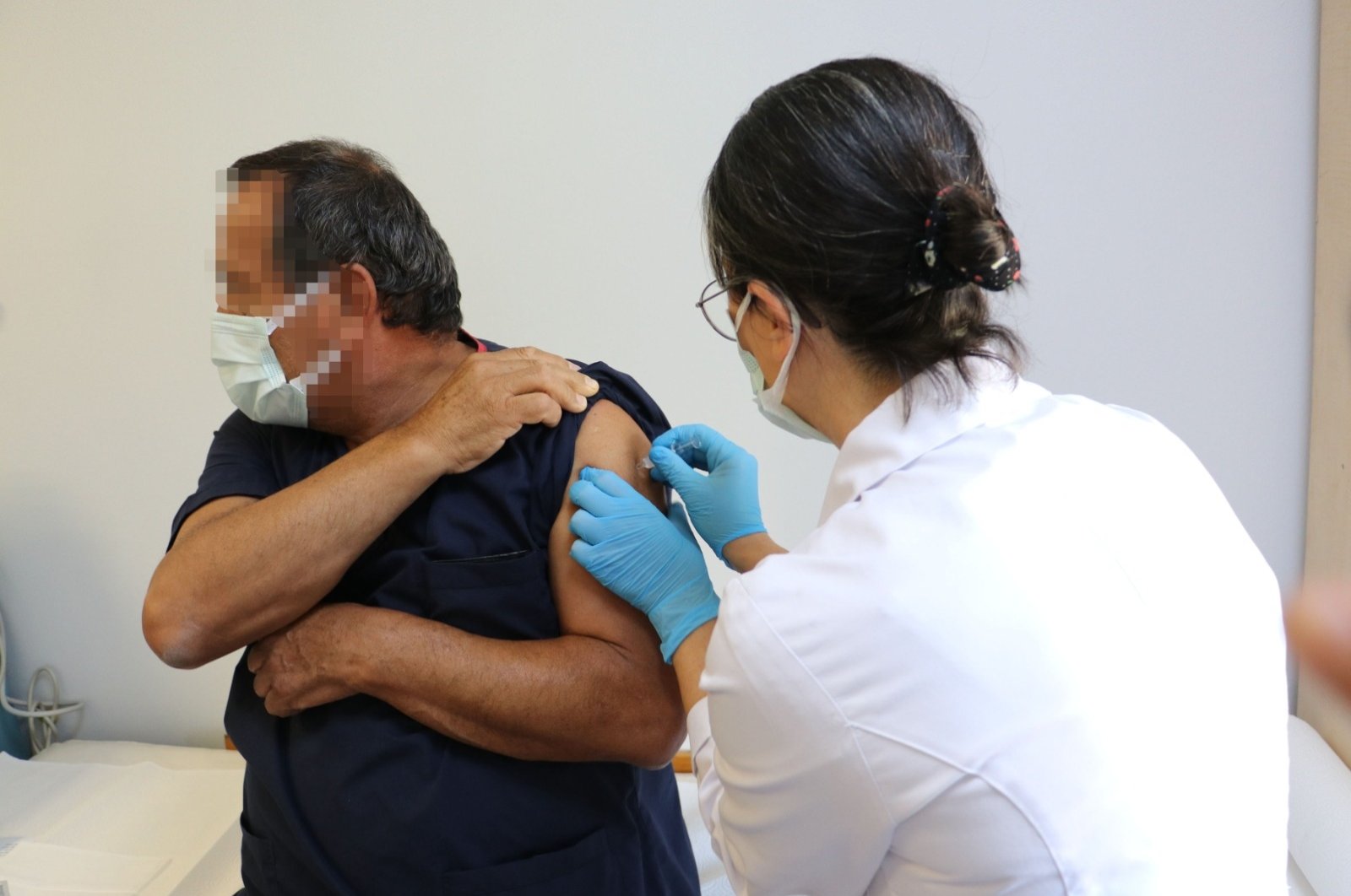 A volunteer is vaccinated at Hacettepe University, in the capital Ankara, Turkey, Sept. 16, 2020. (DHA Photo) 