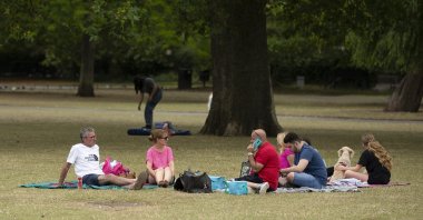 A group of people has a picnic at Regents Park in London, Britain, amid the coronavirus pandemic, Aug. 5, 2020. (PA via Reuters)
