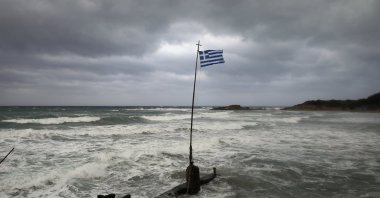 A Greek flag flatters in a beach near the town of Kyllini, as rare storm, known as a Medicane (Mediterranean hurricane), hit western Greece, September 18, 2020. (Reuters Photo)