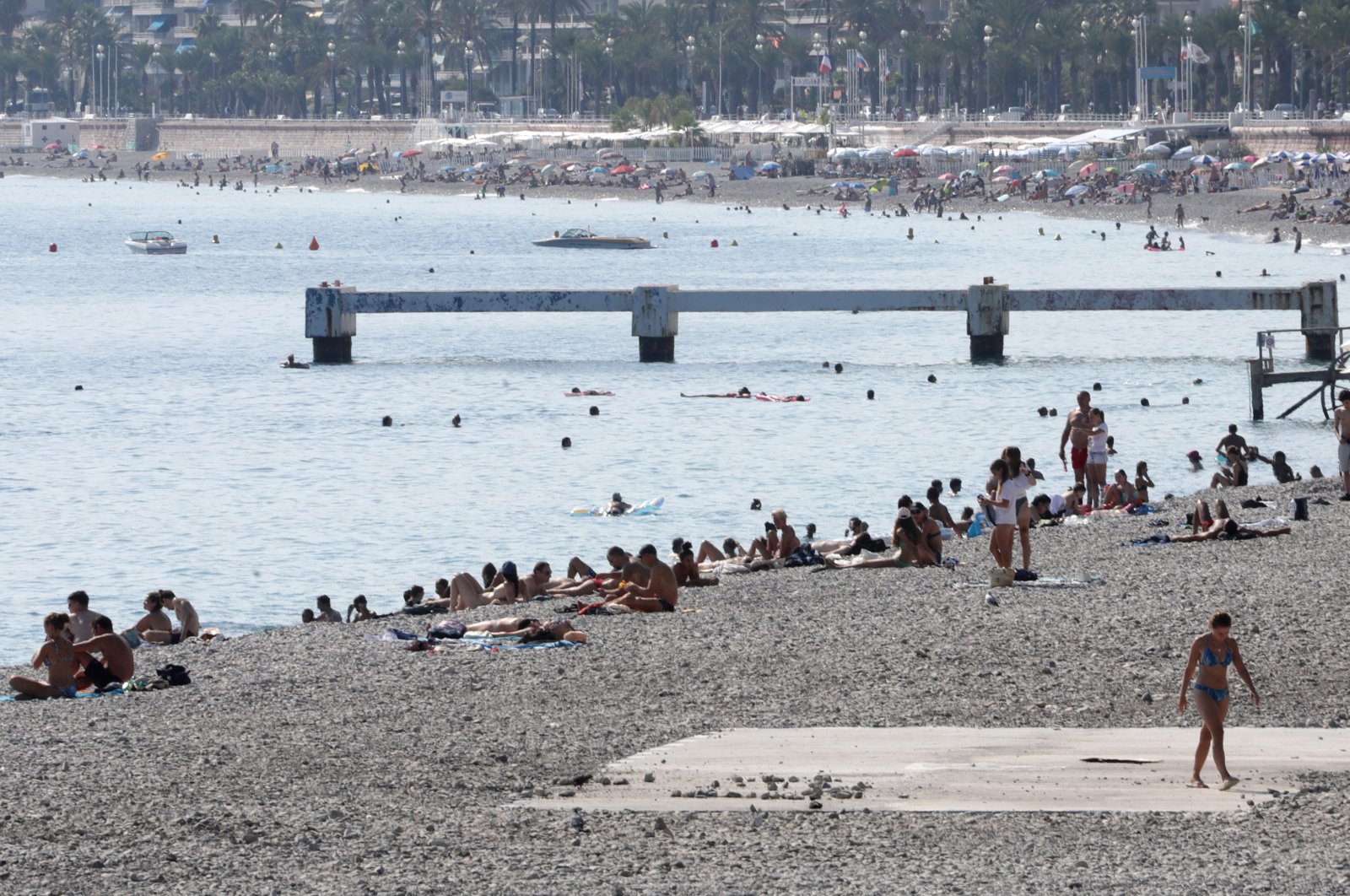 People enjoy a warm and sunny day on the beach in Nice, France, September 14, 2020. (Reuters Photo)