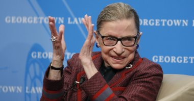 In this April 6, 2018, file photo, Supreme Court Justice Ruth Bader Ginsburg applauds after a performance in her honor after she spoke about her life and work during a discussion at Georgetown Law School in Washington. (AP Photo)