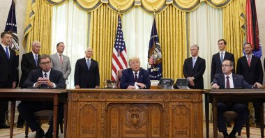 U.S. President Donald Trump (C) speaks after participating in a signing ceremony with Serbian President Aleksandar Vucic (L) and Kosovar Prime Minister Avdullah Hoti in the Oval Office of the White House, Friday, Sept. 4, 2020, in Washington. (AP Photo)