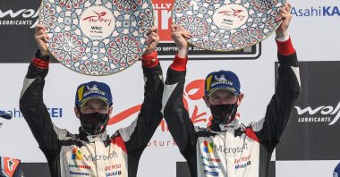 Elfyn Evans (R) and co-driver Scott Martin (L) celebrate their victory during the podium ceremony for the Turkish stage of the 2020 FIA World Rally Championship, in Muğla, Turkey, Sept. 20, 2020. (AFP Photo)
