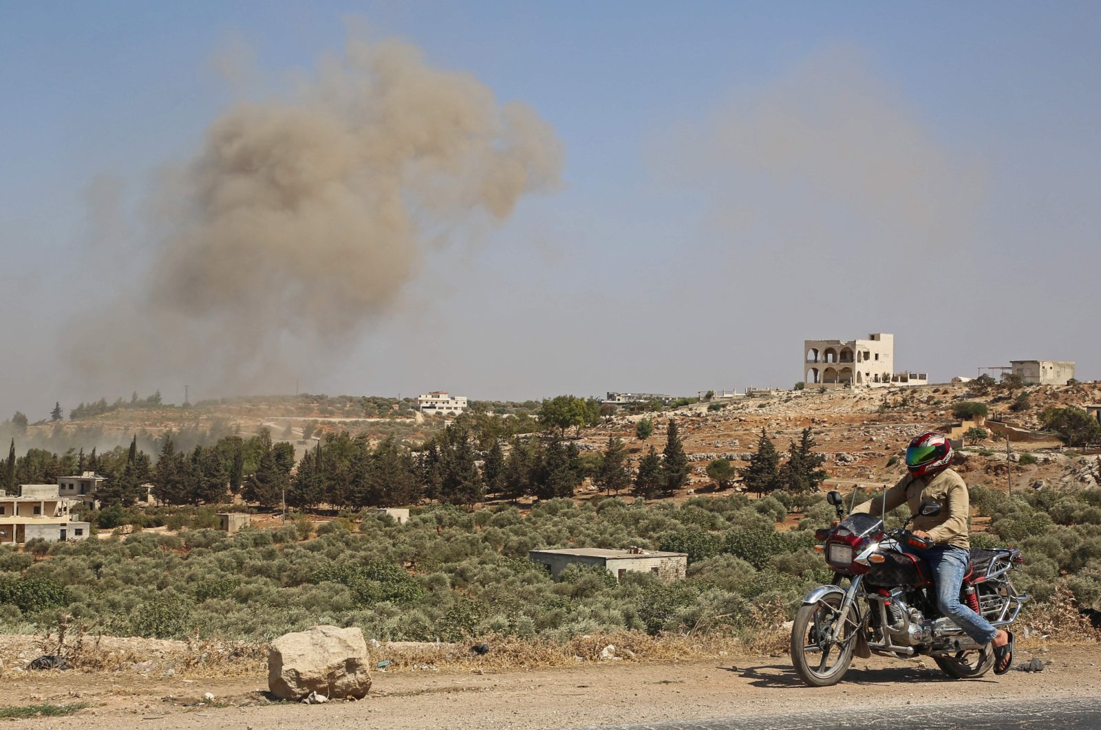 Smoke billows following a reported Russian airstrike on the western outskirts of the Syrian province of Idlib, Sept. 20, 2020. (Photo by AFP)