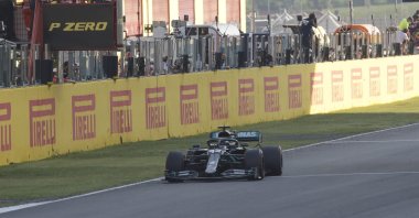 Mercedes driver Lewis Hamilton gets the checkered flag to win the Formula 1 Tuscany GP, in Scarperia, Italy, Sept. 13, 2020. (AP Photo)