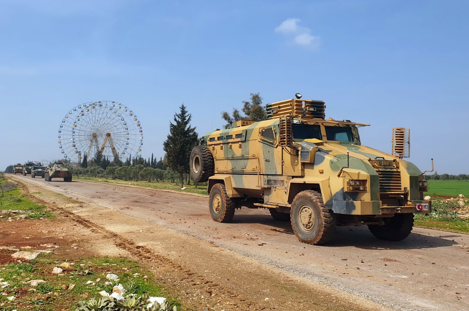 Turkish and Russian troops patrol the M4 highway, which runs east-west through Idlib province, northwest Syria, March 15, 2020. (AP Photo)