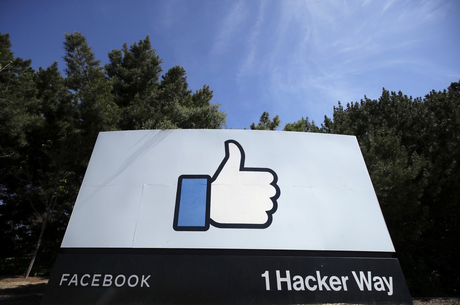 The thumbs-up Like logo is shown on a sign at Facebook's headquarters in Menlo Park, California, April 14, 2020. (AP Photo)