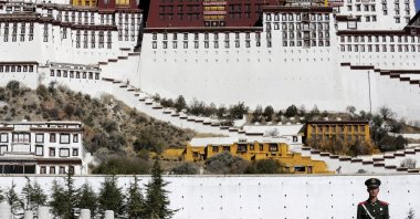 A paramilitary policeman stands guard in front of the Potala Palace in Lhasa, Tibet Autonomous Region, China, Nov. 17, 2015. (Reuters Photo)