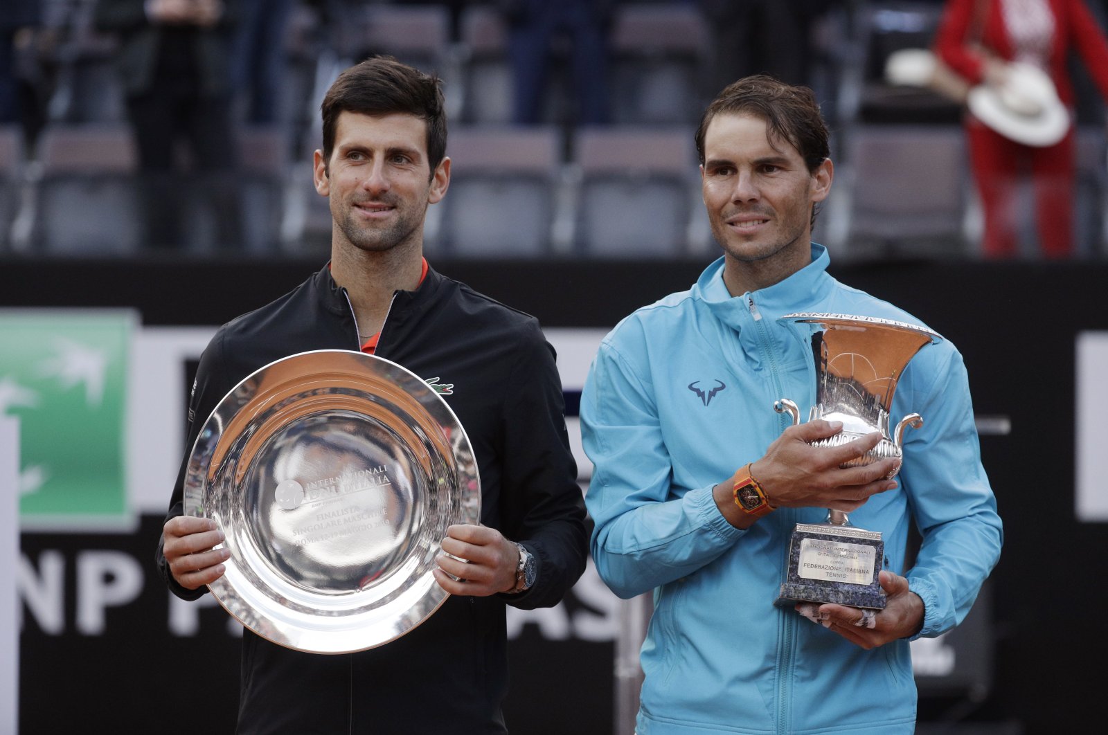 Rafael Nadal (R) and Novak Djokovic pose with their trophies at the end of the Italian Open tennis tournament, in Rome, Italy, May 19, 2019. (AP Photo)