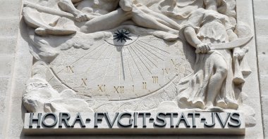 The iconic exterior sculpture at the Palais de Justice – a French palace that houses the Court of Appeal of Paris and the French Court of Cassation – declares its motto: "HORA FUGIT STAT JUS," meaning "the hour passes, justice remains" in Paris, June 13, 2017. (Photo by Getty Images)