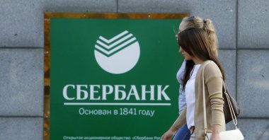 Women walk past an office of Sberbank in Moscow, Russia on Sept. 12, 2014. (Reuters Photo)