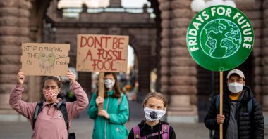Swedish climate activist Greta Thunberg (second R) protests in front of the Swedish parliament, the Riksdagen, Stockholm, Sept. 25, 2020. (AFP Photo)