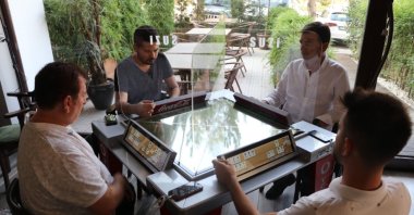 People play okey at the digital table, in Denizli, western Turkey, Sept. 23, 2020. (DHA Photo) 