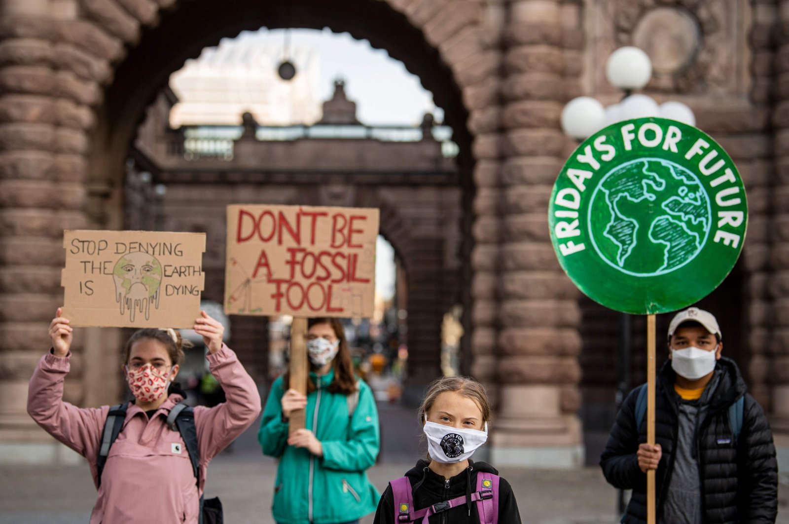 Swedish climate activist Greta Thunberg (second R) protests in front of the Swedish parliament, the Riksdagen, Stockholm, Sept. 25, 2020. (AFP Photo)