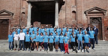 Runners pose prior to the start of a 180-kilometer relay race, in Codogno, Italy, Saturday, Sept. 26, 2020.  (AP Photo)