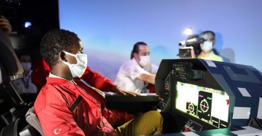 Guled Abdi in a flight simulator at Teknofest event, in Gaziantep, southern Turkey, Sept. 27, 2020. (DHA Photo) 