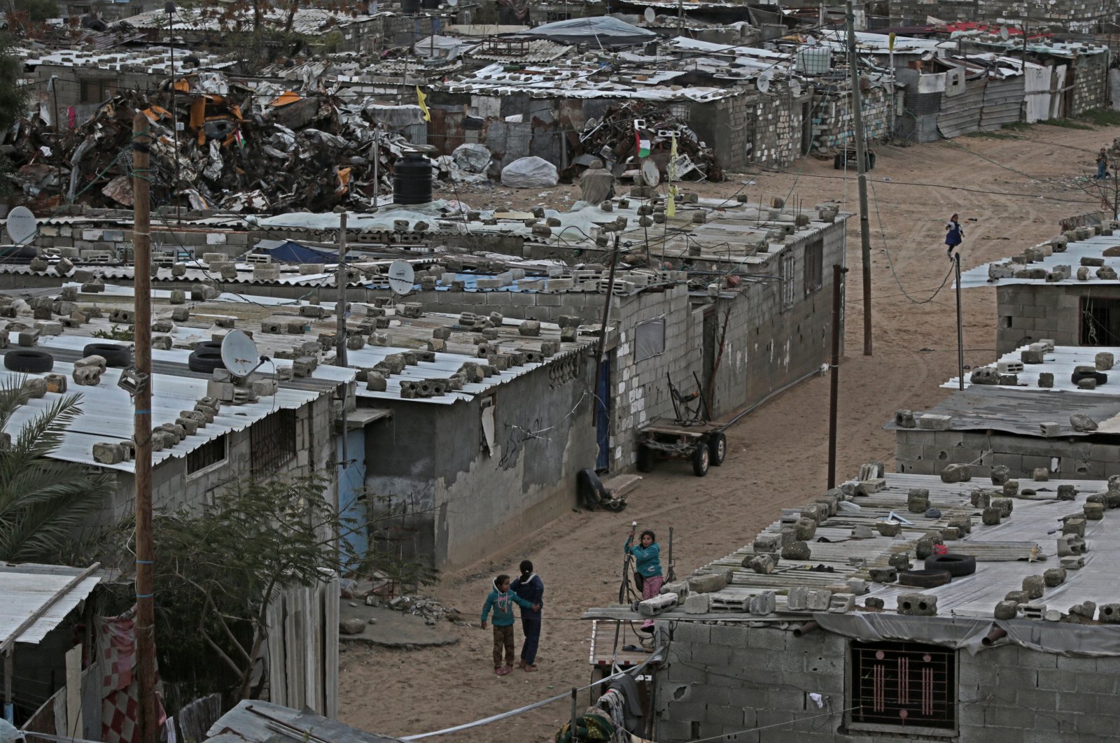 Palestinian refugee children play outside their family homes in Kham Younis refugee camp in the Southern Gaza Strip, Jan.19, 2018. (EPA-EFE Photo)