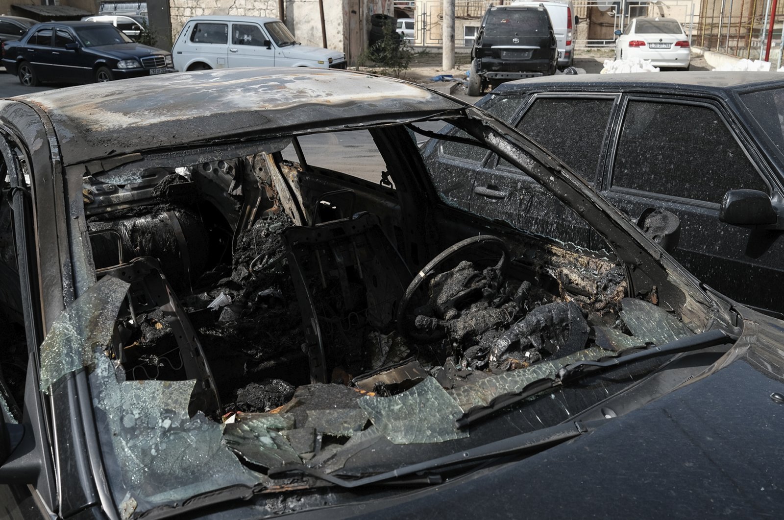 A car destroyed by shelling in Stepanakert, the self-proclaimed capital of Nagorno-Karabakh, Azerbaijan, Sept. 29, 2020. (AP Photo)