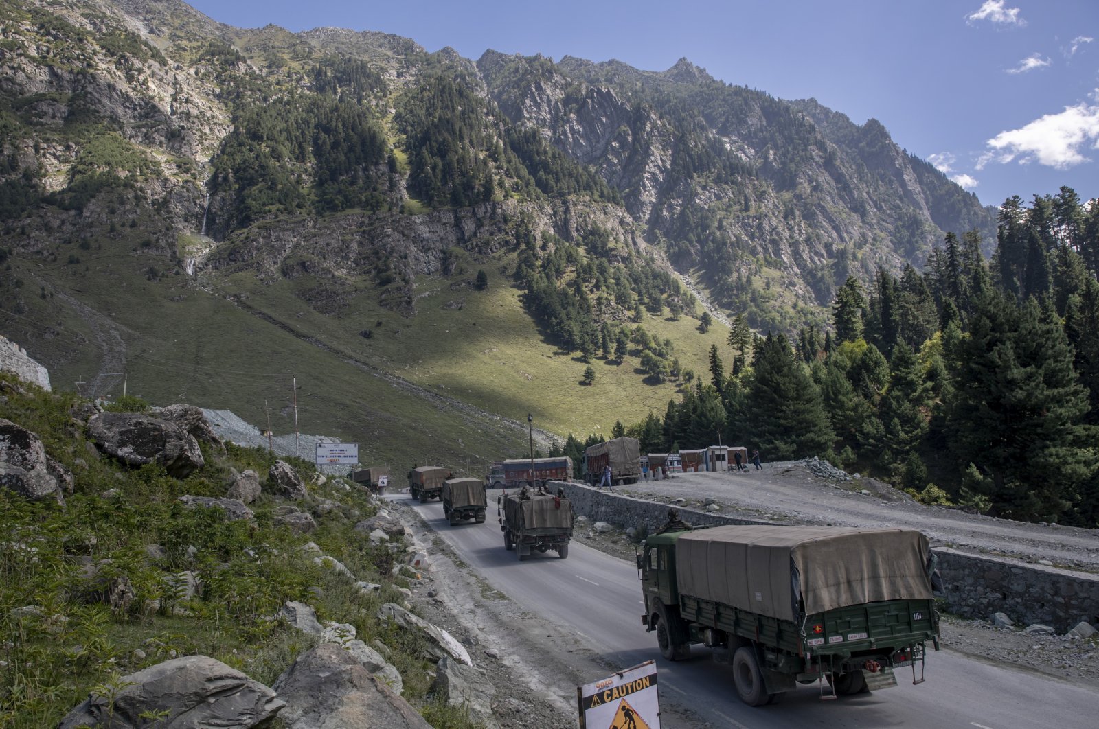 An Indian Army convoy moves on the Srinagar-Ladakh highway in Gagangeer, northeast of Srinagar, Indian-controlled Kashmir, Sept. 9, 2020. (AP Photo)