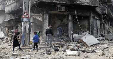 In this file photo, Syrian children remove rubble in the once rebel-held Bustan al-Qasr neighborhood in eastern Aleppo, Syria, Jan. 20, 2017. (AP Photo)