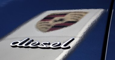 The word "diesel" and the logo of German car manufacturer Porsche, Stuttgart, Germany, Nov. 4, 2015. (DPA via AP)