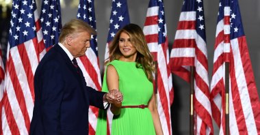 U.S. President Donald Trump (L) arrives with wife First Lady Melania Trump to deliver his acceptance speech for the Republican Party nomination for reelection during the final day of the Republican National Convention from the South Lawn of the White House in Washington, D.C, Aug.27, 2020. (AFP Photo)