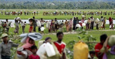 Rohingya refugees, who crossed the border from Myanmar two days before, walk after they received permission from the Bangladeshi army to continue on to the refugee camps, in Palang Khali, Bangladesh, Oct. 19, 2017. (Reuters Photo)