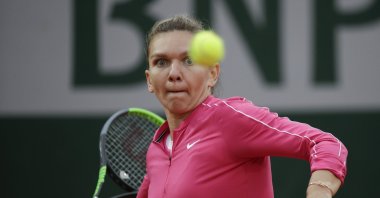 Simona Halep plays a shot against Irina-Camelia Begu during a French Open tennis match, in Paris, France, Sept. 30, 2020. (AP Photo)